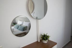 Postel nebo postele na pokoji v ubytování Aurora - Rooms & Suites - Spetses