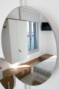 Postel nebo postele na pokoji v ubytování Aurora - Rooms & Suites - Spetses