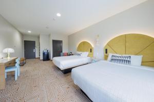 Postel nebo postele na pokoji v ubytování Blanco River Hotel