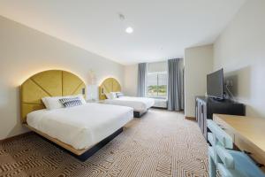 Postel nebo postele na pokoji v ubytování Blanco River Hotel