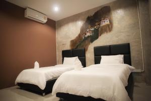 Postel nebo postele na pokoji v ubytování B-Cozy Hotel