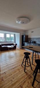 a large living room with a table and a couch at Ausblick Freital 2 in Freital