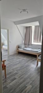 a large room with a bed and a window at Ausblick Freital 2 in Freital