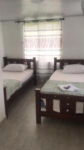 Postel nebo postele na pokoji v ubytování HOTEL Mira Cruz + 12 fotografií