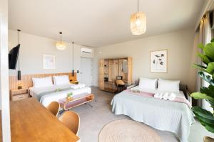 A bed or beds in a room at Petrichor