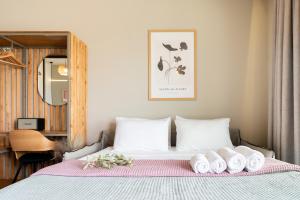 A bed or beds in a room at Petrichor