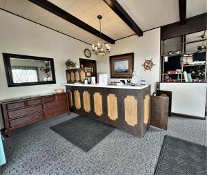 a kitchen with a counter and a sink in a room at Siesta Motel in Mitchell