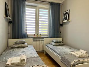 Ένα ή περισσότερα κρεβάτια σε δωμάτιο στο Apartament Next to Old Town
