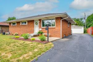 a red brick house with a driveway at Columbus Vacation Rental, 7 Mi to Downtown! in Columbus