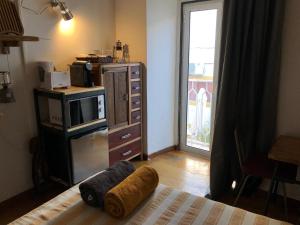 a room with a bed with towels on it at Joao`s INN in Castelo de Vide