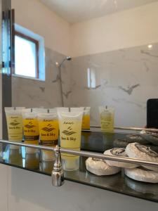 a counter in a kitchen with yellow items on it at Villa Pogradeci in Pogradec +67 photos