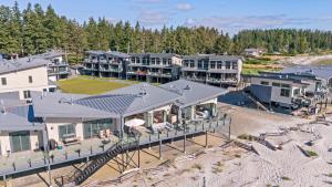 an aerial view of a house on the beach at Coastal Haven at THE BEACH HOUSE in Campbell River