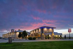 a hotel with a lit up building at night at Best Western Plus Mid Nebraska Inn & Suites in Kearney