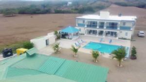 an aerial view of a house with a swimming pool at Punta rucia doña elsa villas in Punta Rucia