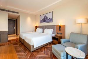 Grand Mirage Dhanbad, a member of Radisson Individuals客房内的一张或多张床位