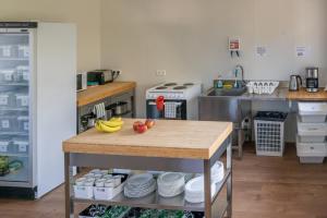a kitchen with a table with fruit on it at Vogar Travel Service in Myvatn