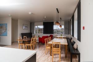 a kitchen and dining room with a table and chairs at Vogar Travel Service in Myvatn