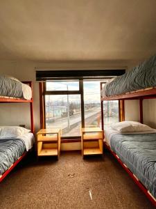 Postel nebo postele na pokoji v ubytování Hostel Rosa de los Vientos