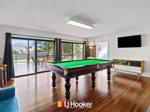 a living room with a pool table at Iluka Calling in Iluka