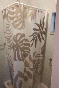 a shower curtain in a bathroom with a shower at Apartments with parking space Murvica, Brac - 23462 in Bol