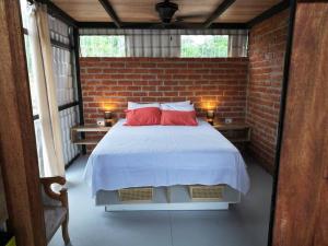 Postel nebo postele na pokoji v ubytování Casa Sol del Oriente - Emilio