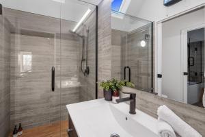 a bathroom with a sink and a shower at Overdale Oasis in Christchurch +37 photos