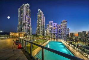 a pool on the roof of a building with a city skyline at Apartment in Miami downtown in Miami