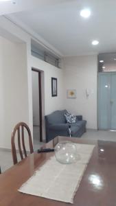 a living room with a table and a couch at Temporario Aguilares in Aguilares
