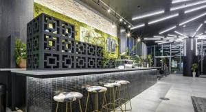 a lobby with a bar with plants on the wall at Apartment in Miami downtown in Miami +19 photos