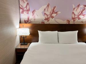 Postel nebo postele na pokoji v ubytování Guide Hotel Taipei NTU
