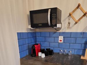 Příslušenství pro přípravu čaje a kávy v ubytování Tapioca Vila Boutique