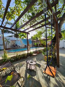 a swing set in front of a skate park at Casa de Praia Araçagy in Macajatuba