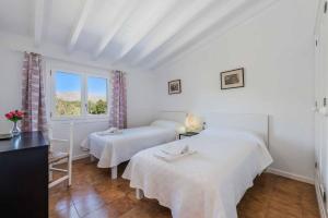 Ein Bett oder Betten in einem Zimmer der Unterkunft Can Patricia