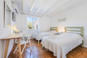 Ein Bett oder Betten in einem Zimmer der Unterkunft Can Patricia
