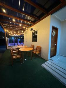 a dining room with a table and chairs and lights at POUSADA ALTER PARA TODOS in Alter do Chao