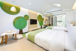 Postel nebo postele na pokoji v ubytování CHECK inn MAGI Kids Hotel
