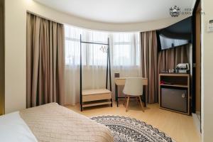 Postel nebo postele na pokoji v ubytování Stanton Gaya Hotel