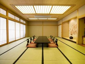 a conference room with a long table and chairs at Ishikin in Gifu