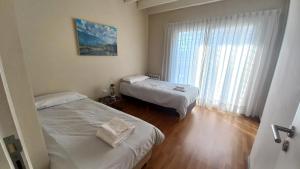 Ένα ή περισσότερα κρεβάτια σε δωμάτιο στο Andina Apartment +5 φωτογραφίες