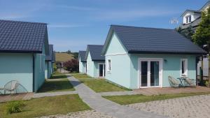 a row of houses in a residential neighborhood at MIELENKO BEACH - domki in Mielenko