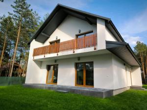 a rendering of a house with a balcony at Roztoczańska Przystań in Majdan Sopocki