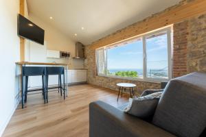 Μια τηλεόραση ή/και κέντρο ψυχαγωγίας στο Apartamentos playa Buendia