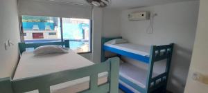 Ένα ή περισσότερα κρεβάτια σε δωμάτιο στο TOLU ALOJAMIENTOS Oasis tropical elegante, relax, apartamento amoblado