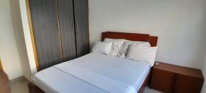 Ένα ή περισσότερα κρεβάτια σε δωμάτιο στο TOLU ALOJAMIENTOS Oasis tropical elegante, relax, apartamento amoblado