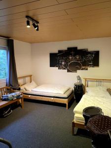 Postel nebo postele na pokoji v ubytování Ferienhaus Spacekoov Proberaum Studio Bandurlaub