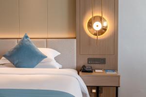 Poltton International Hotel - Chaozhou Hanjiang客房内的一张或多张床位