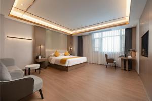 Poltton International Hotel - Chaozhou Hanjiang客房内的一张或多张床位