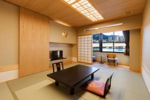 a living room with a table and a window at Ishikin in Gifu +20 photos