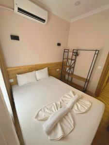 Postel nebo postele na pokoji v ubytování Dila Apart Hotel