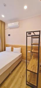 Postel nebo postele na pokoji v ubytování Dila Apart Hotel